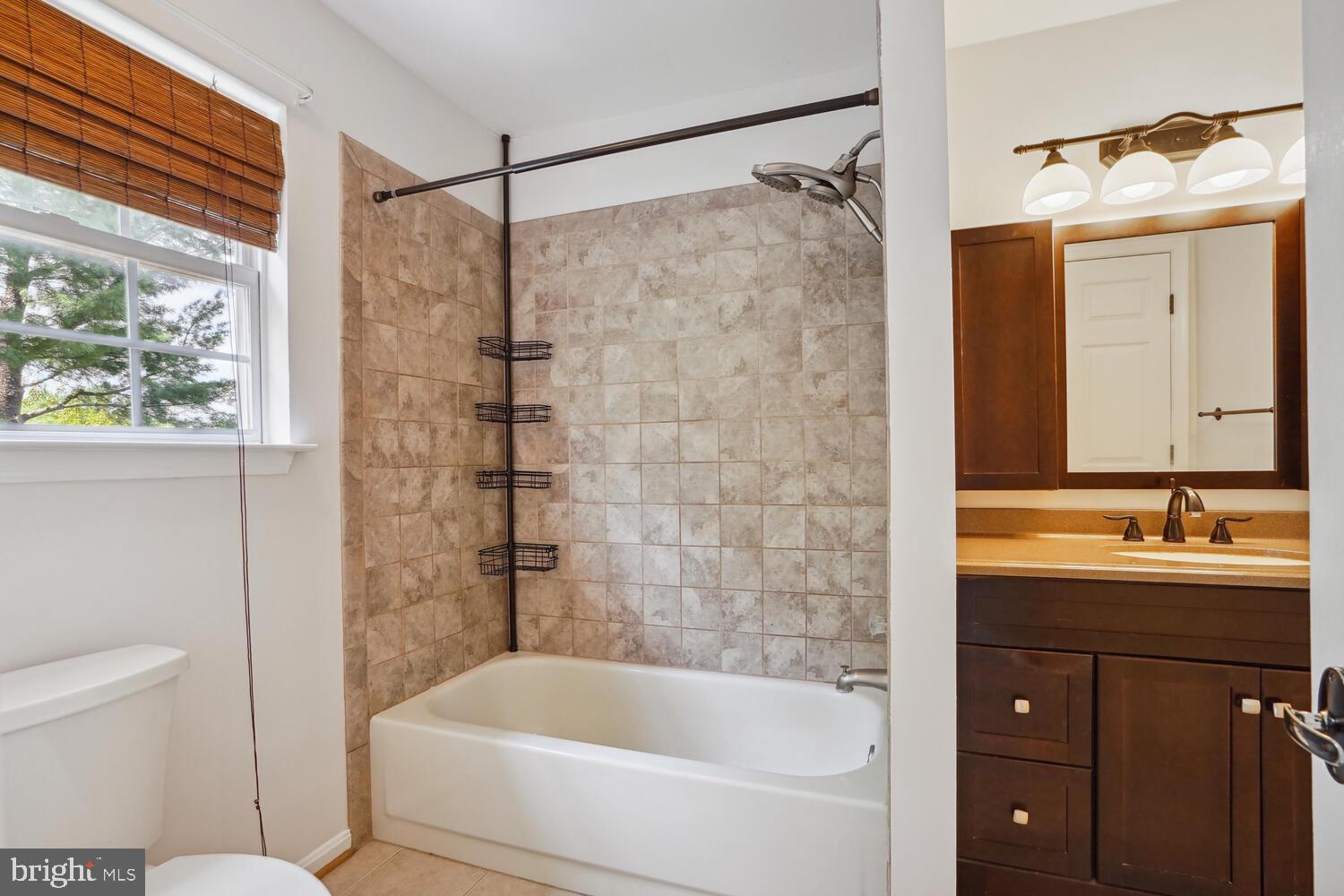 9205 Ridgefield Circle Frederick, MD 21701 - Photo 10 of 19 a bathroom with a tub a sink and a shower