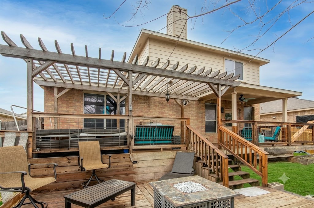 508 Emma Rose Trail Leander, TX 78641 - Photo 11 of 40 A spacious multi-level deck offers diverse outdoor living spaces, perfect for entertaining or quiet relaxation.