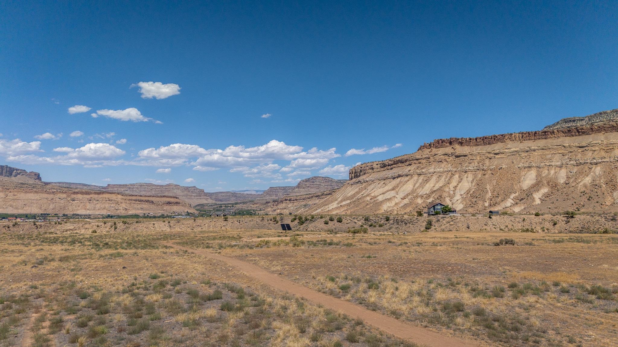 589 39 Road Palisade, CO 81526 - Photo 37 of 40 a view of a dry yard with wooden fence