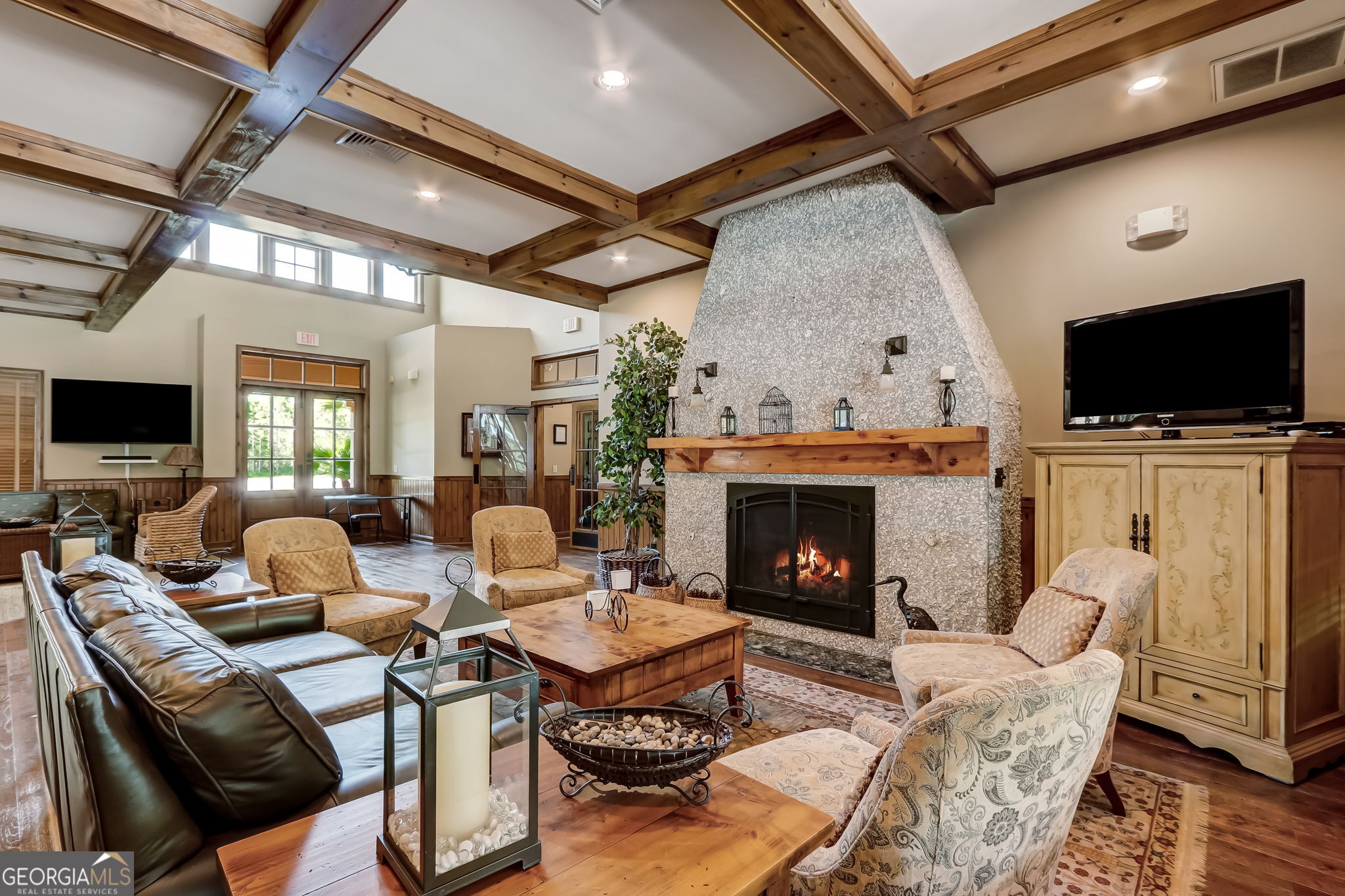 115 Tidal Marsh Way St. Marys, GA 31558 - Photo 15 of 17 a living room with furniture a flat screen tv and a fireplace