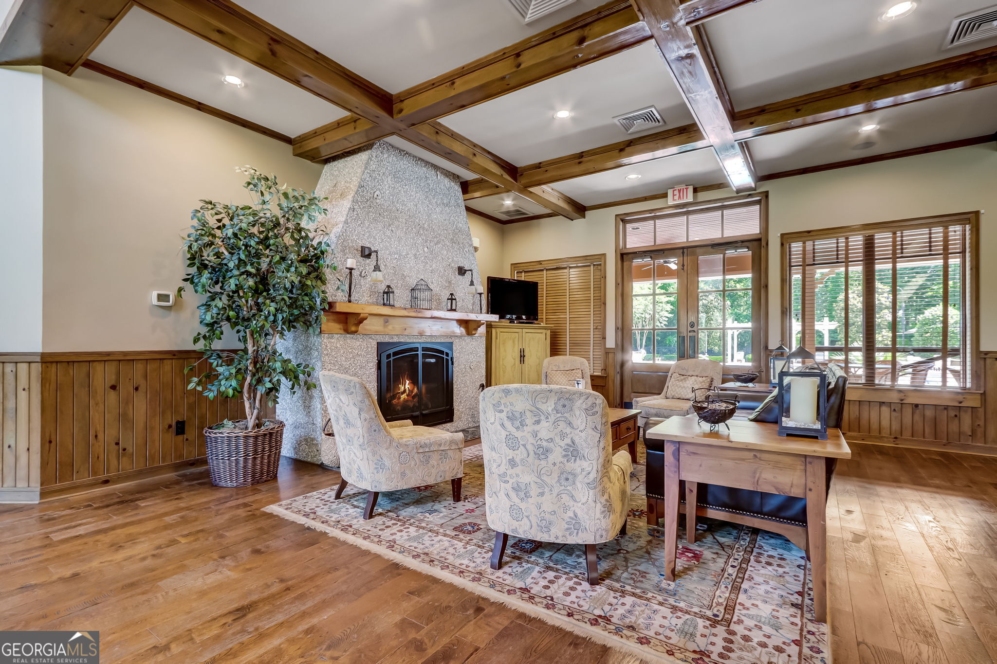 115 Tidal Marsh Way St. Marys, GA 31558 - Photo 16 of 17 a living room with furniture a fireplace and a table