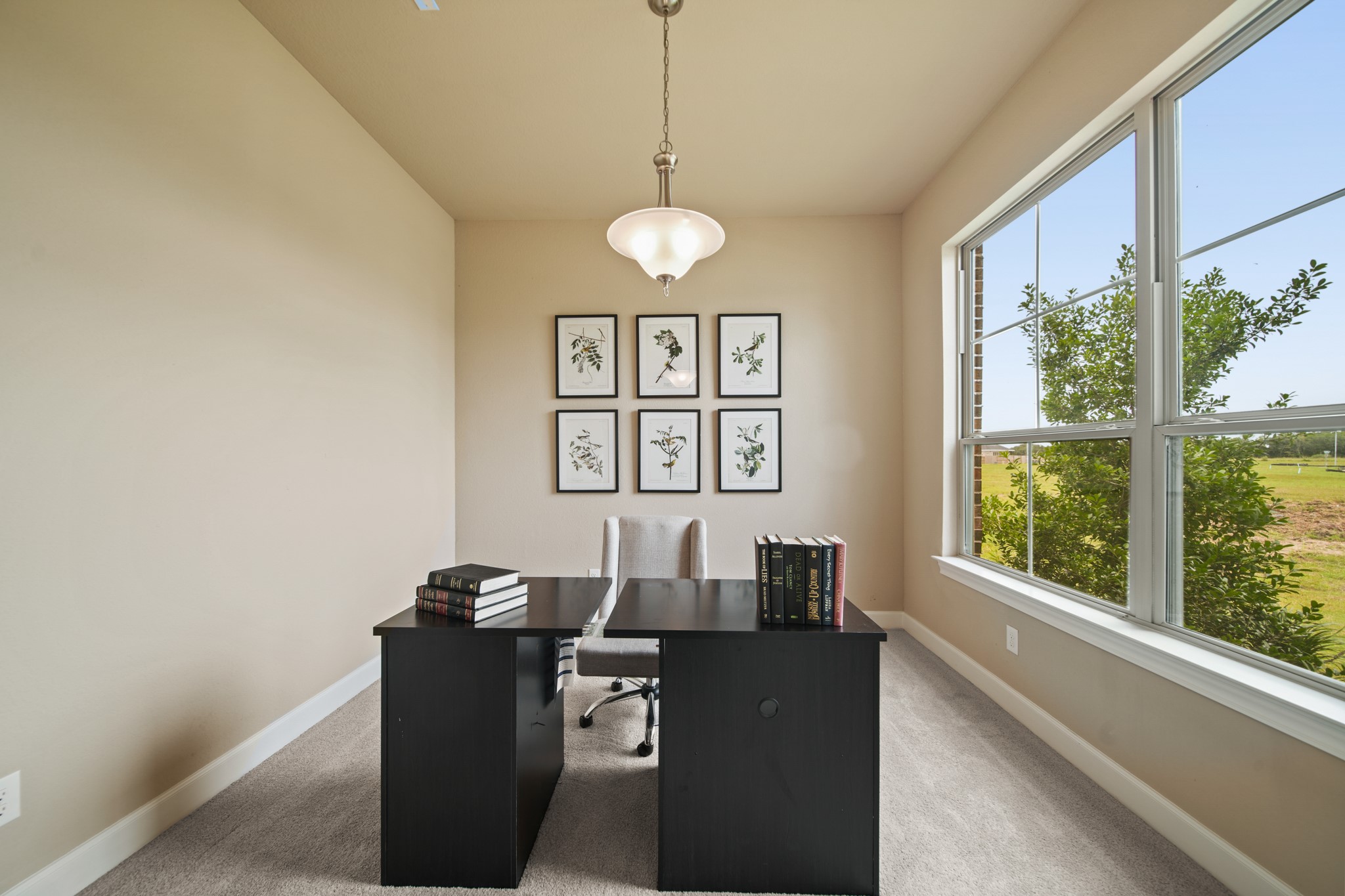 5602 Caracara Street Manvel, TX 77578 - Photo 2 of 15 a view of a workspace with furniture and a window