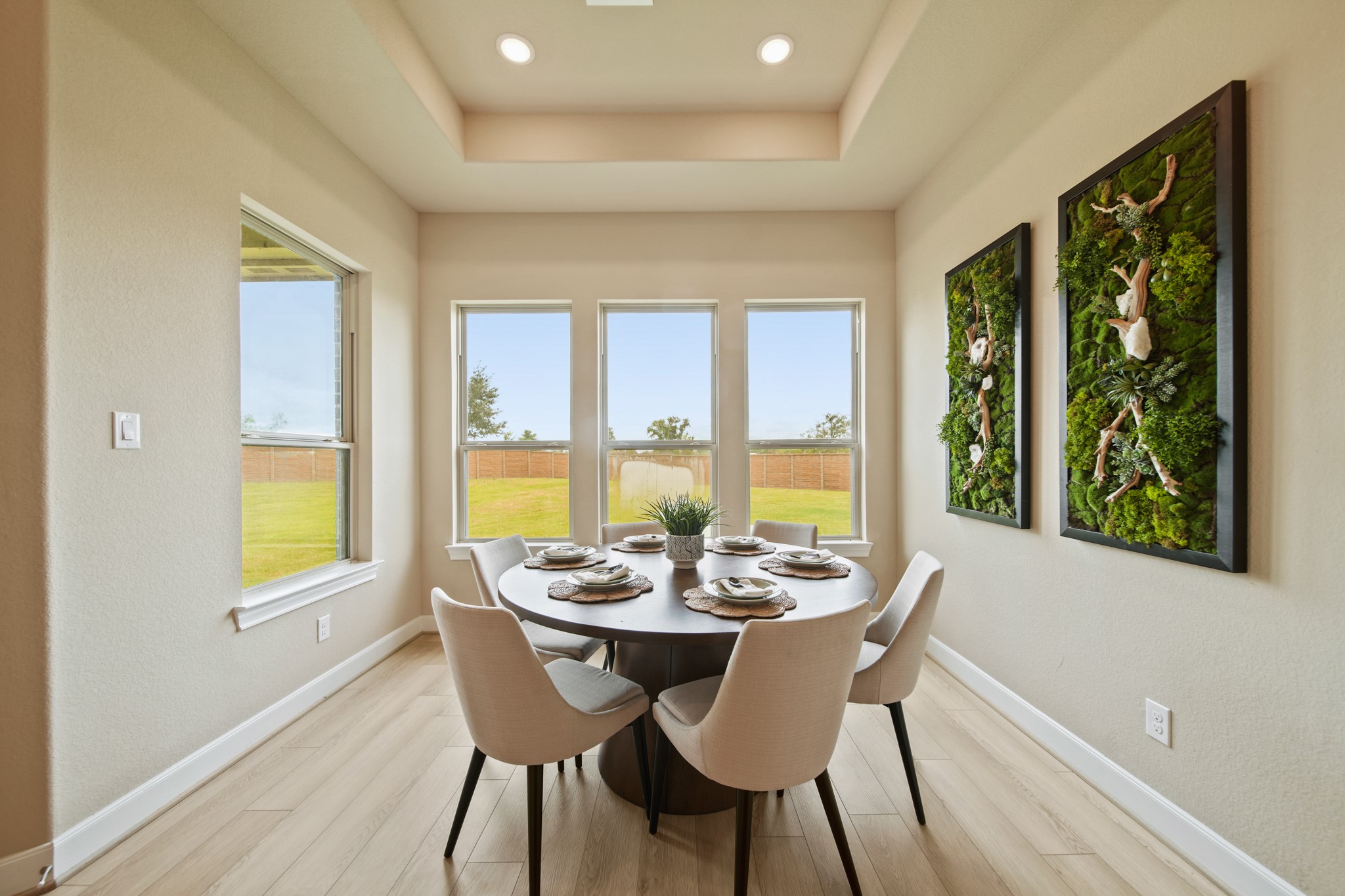 5602 Caracara Street Manvel, TX 77578 - Photo 7 of 15 a dining room with furniture a chandelier and wooden floor