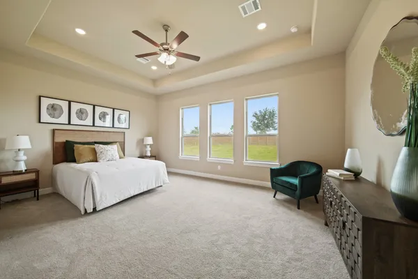 a bed room with a bed and a chair