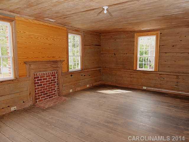 6701 Providence Road Charlotte, NC 28270 - Photo 11 of 13 an empty room with wooden floor and windows