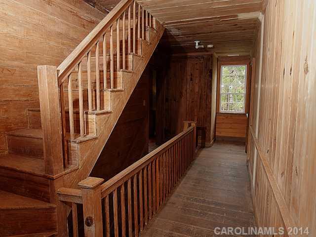 6701 Providence Road Charlotte, NC 28270 - Photo 12 of 13 a view of staircase with wooden floor and stairs
