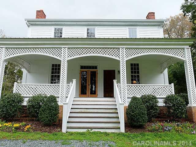 6701 Providence Road Charlotte, NC 28270 - Photo 4 of 13 a front view of a house with a garden