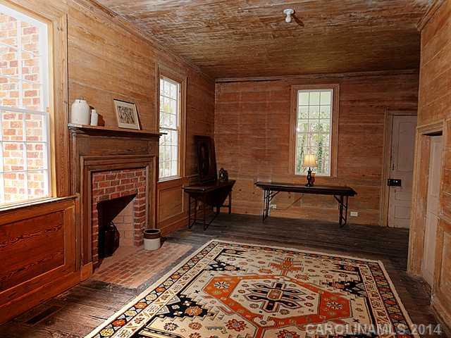 6701 Providence Road Charlotte, NC 28270 - Photo 7 of 13 a living room with furniture and a fireplace