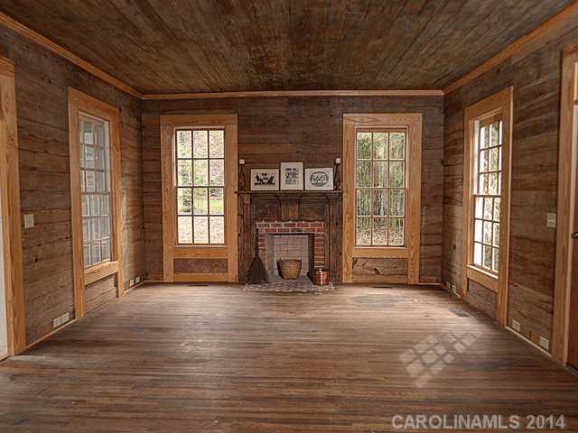 6701 Providence Road Charlotte, NC 28270 - Photo 8 of 13 a view of an empty room with a fireplace and a window