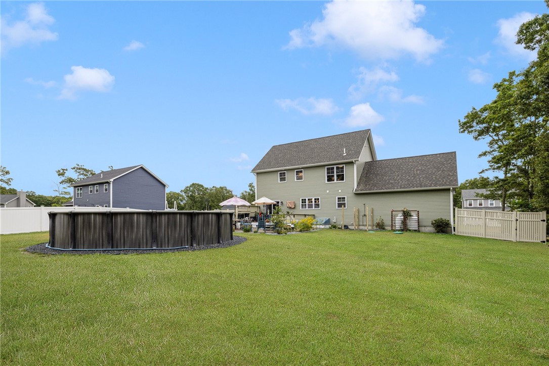 93 Harbor Ridge Lane Tiverton, RI 02878 - Photo 5 of 44 Partially fenced in backyard - above ground pool