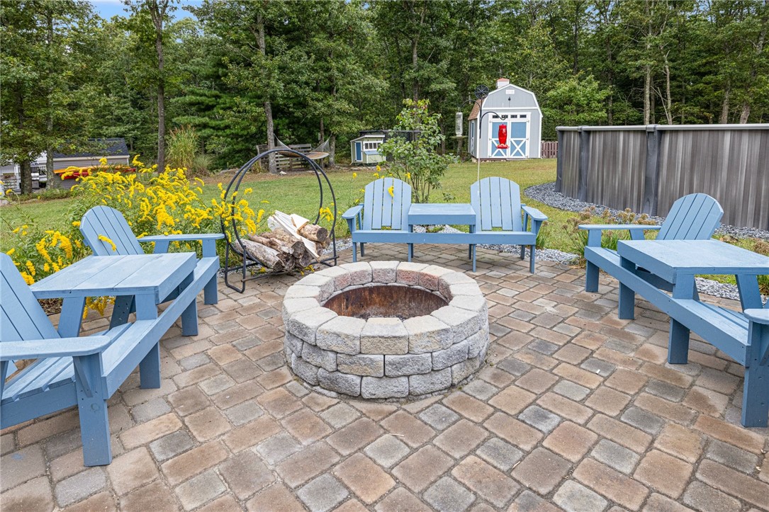 93 Harbor Ridge Lane Tiverton, RI 02878 - Photo 8 of 44 Fire pit off designer paver patio