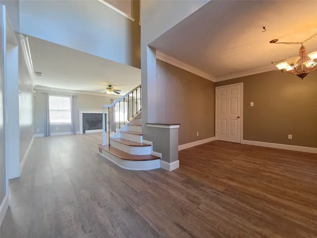 a view of a livingroom with wooden floor