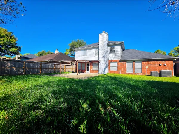 a view of a building with a yard