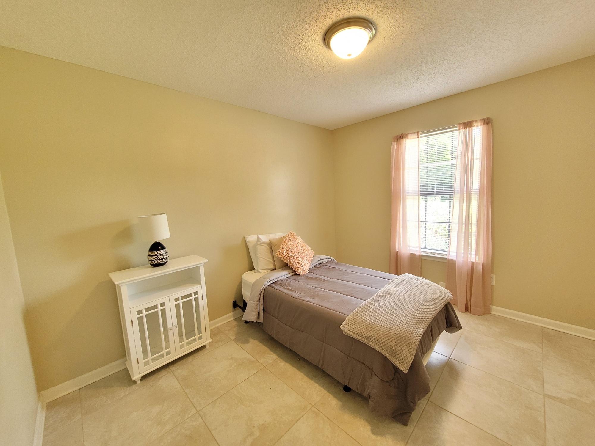 4 Holly Road Crestview, FL 32539 - Photo 17 of 30 a bedroom with a bed and a window