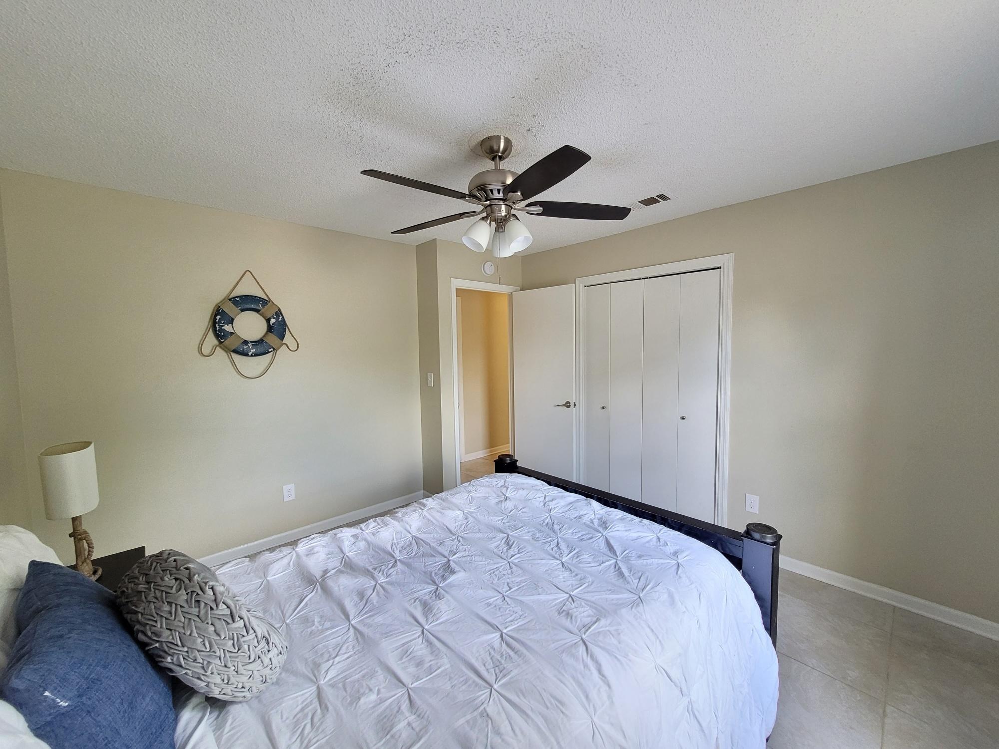 4 Holly Road Crestview, FL 32539 - Photo 22 of 30 a bedroom with a bed and a ceiling fan