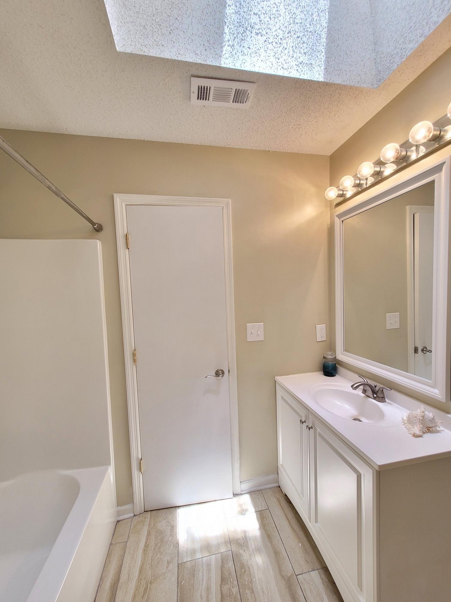 4 Holly Road Crestview, FL 32539 - Photo 28 of 30 a bathroom with a tub sink and mirror