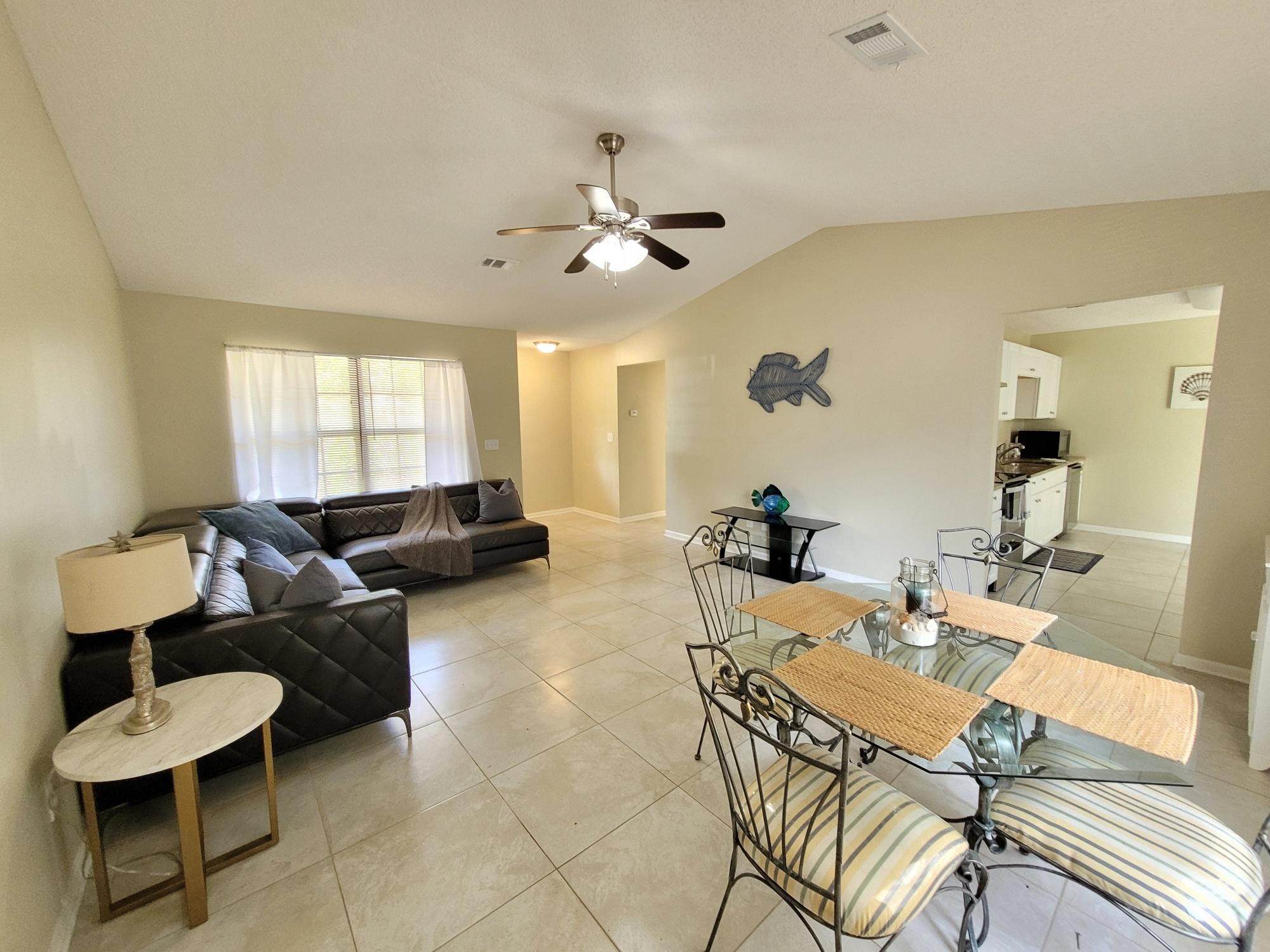 4 Holly Road Crestview, FL 32539 - Photo 7 of 30 a living room with furniture and a large window