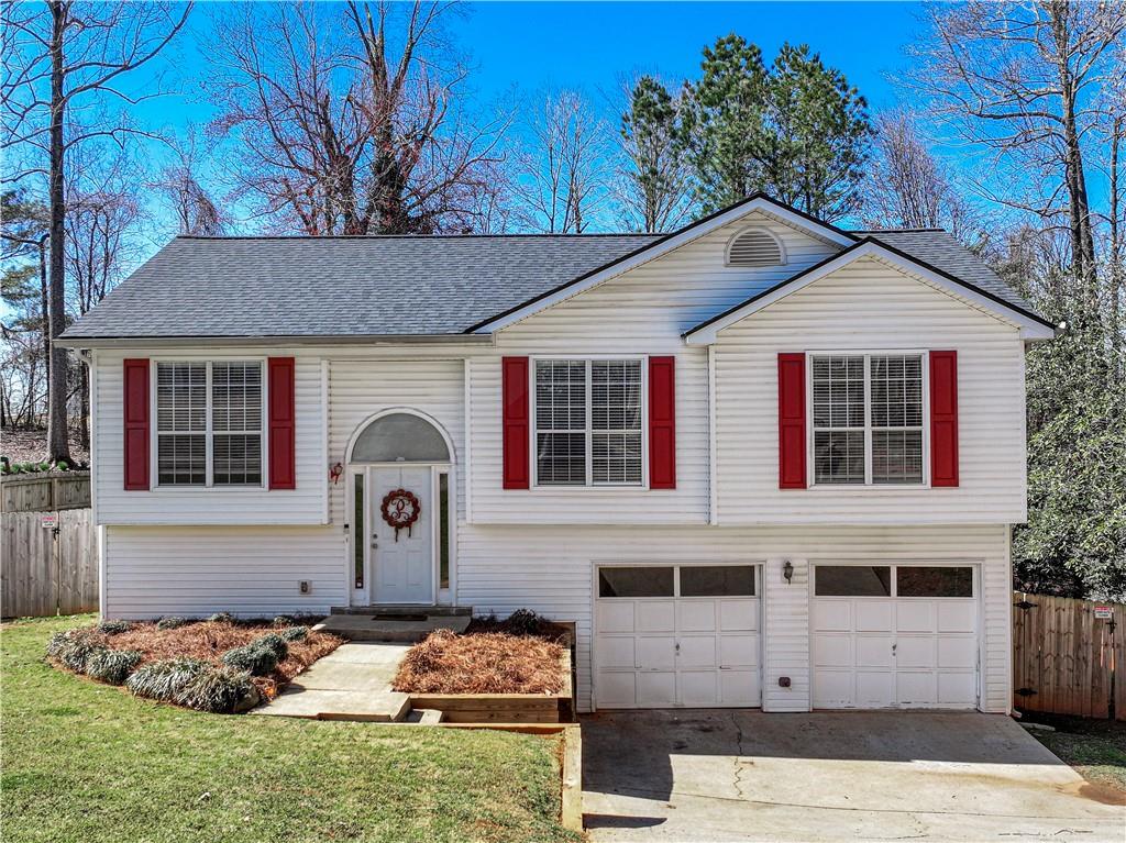 5313 High Point Road Flowery Branch, GA 30542 - Photo 1 of 1 a front view of a house with garden