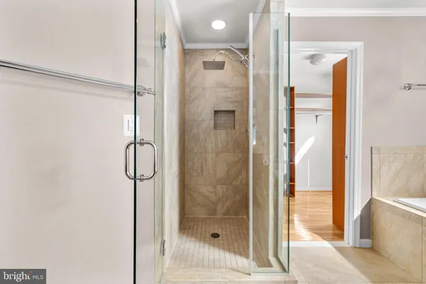 a bathroom with a tub and shower