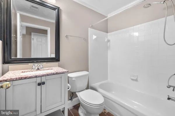 a bathroom with a toilet a sink and a bathtub