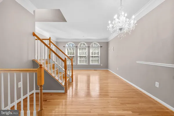 a view of an entryway with wooden floor