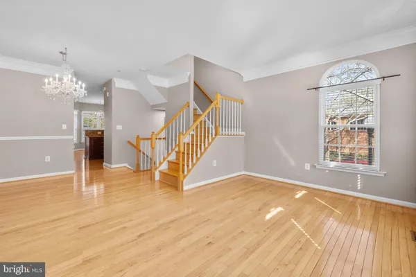 a view of an empty room with stairs