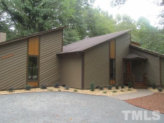 4003 Hope Valley Road Durham, NC 27707 - Photo 2 of 20 Notice the Wood accents over the new windows. Rock mulch and new landscaping just add to the charm of this home.