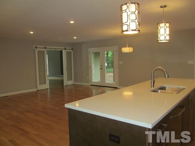 4003 Hope Valley Road Durham, NC 27707 - Photo 11 of 20 The kitchen is open to the Living/Dining area. French style doors lead out to deck.