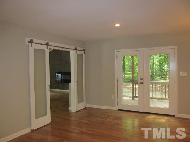 4003 Hope Valley Road Durham, NC 27707 - Photo 12 of 20 Barn doors are used to access the Large Family area.
