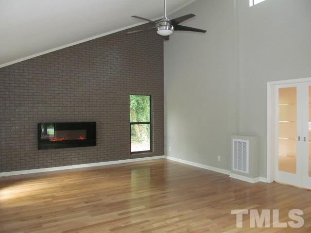 4003 Hope Valley Road Durham, NC 27707 - Photo 14 of 20 The Family area has a vaulted brick accent wall with an electric fireplace. It's really beautiful.