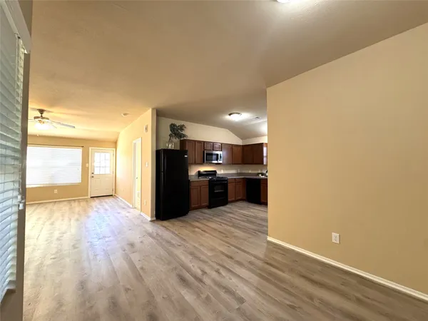 a view of kitchen with wooden floor