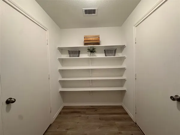 a view of a hallway with staircase