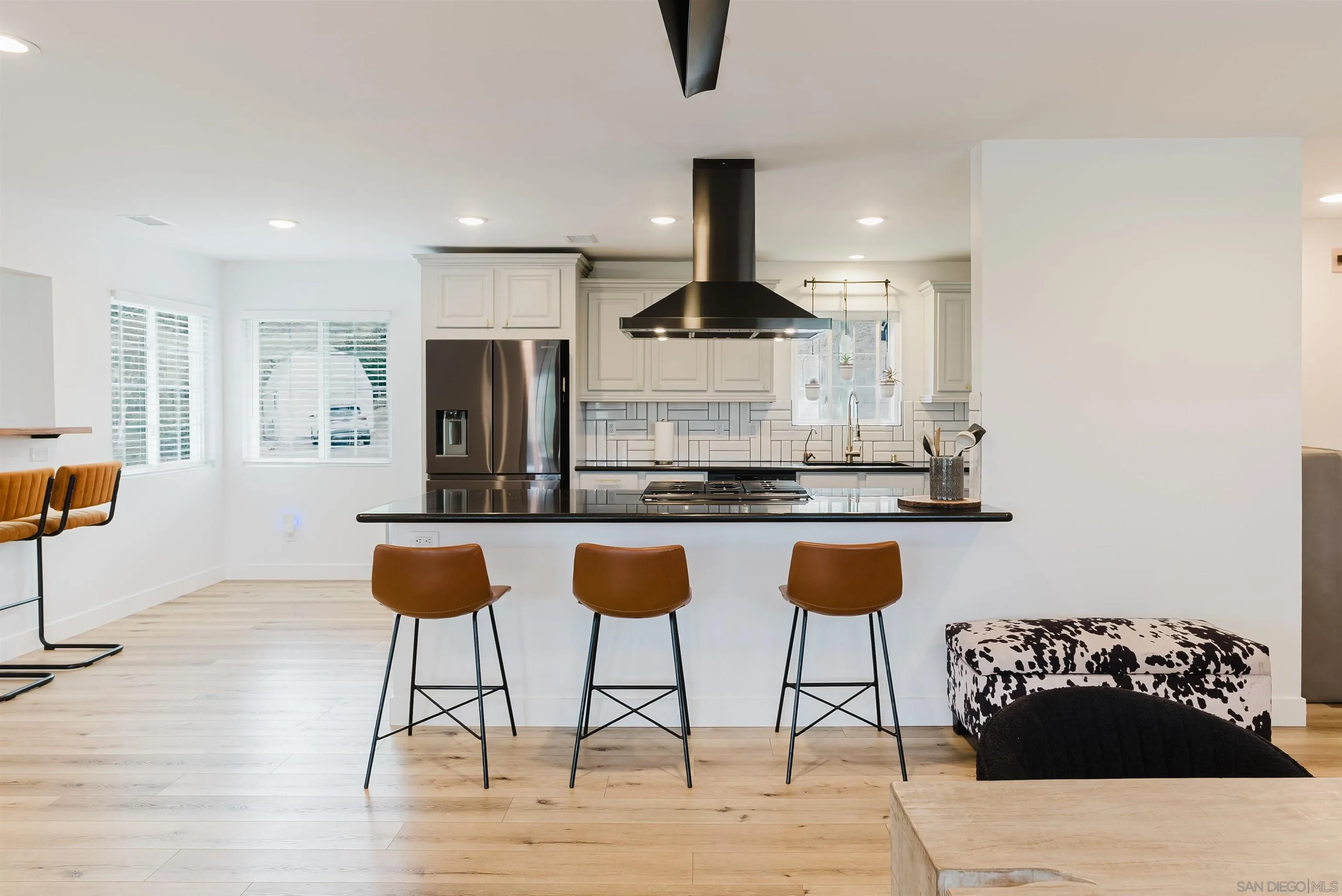 11911 Rocoso Road Lakeside, CA 92040 - Photo 14 of 32 a living room with stainless steel appliances kitchen island granite countertop furniture and a view of kitchen