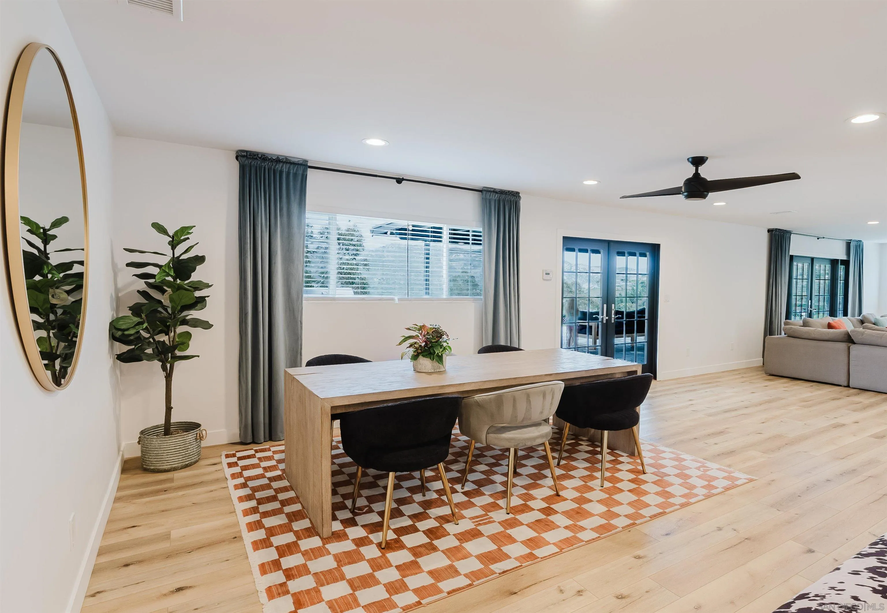 11911 Rocoso Road Lakeside, CA 92040 - Photo 16 of 32 a living room with furniture and a potted plant