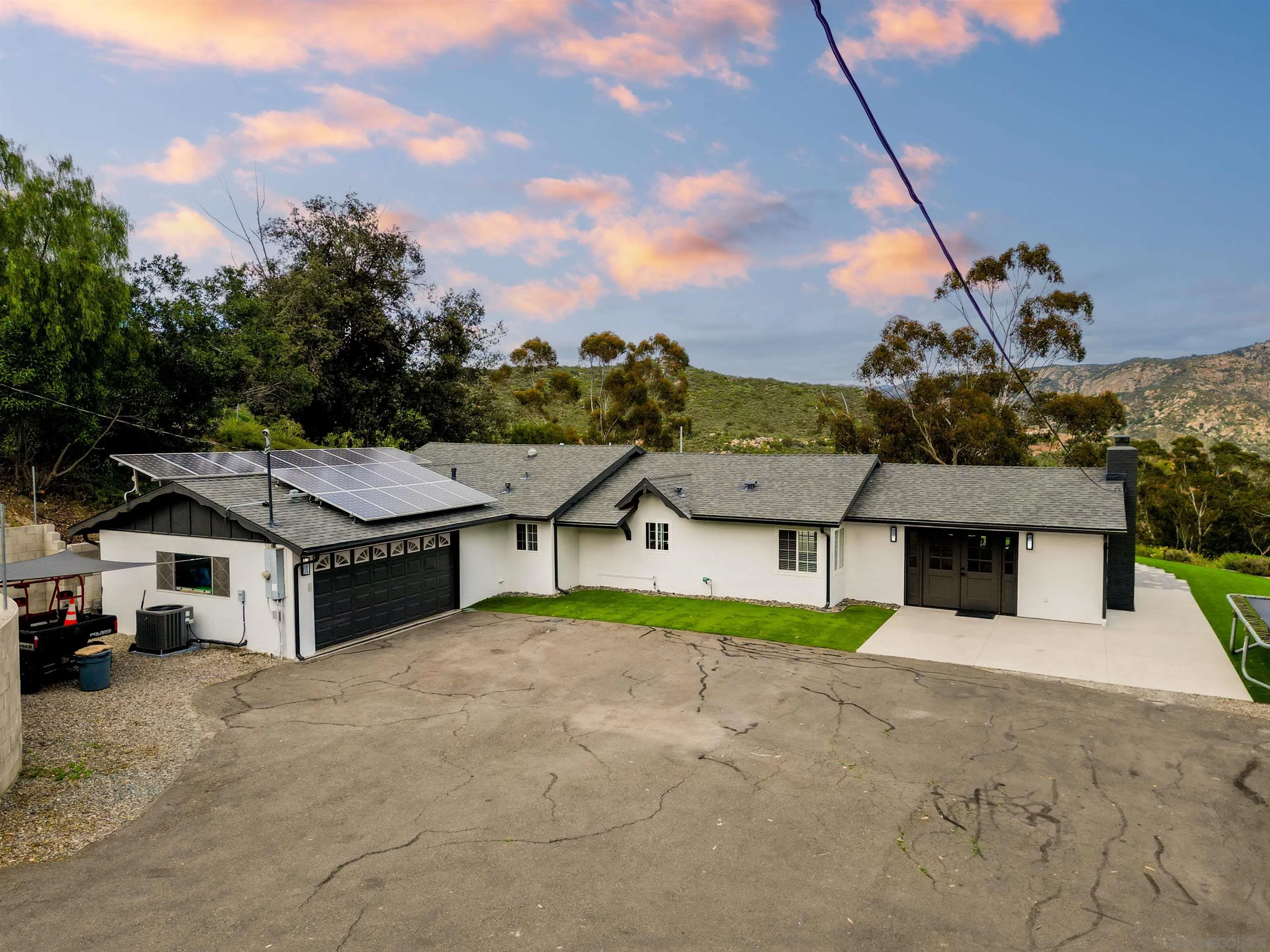 11911 Rocoso Road Lakeside, CA 92040 - Photo 23 of 32 a aerial view of a house with a garden and yard