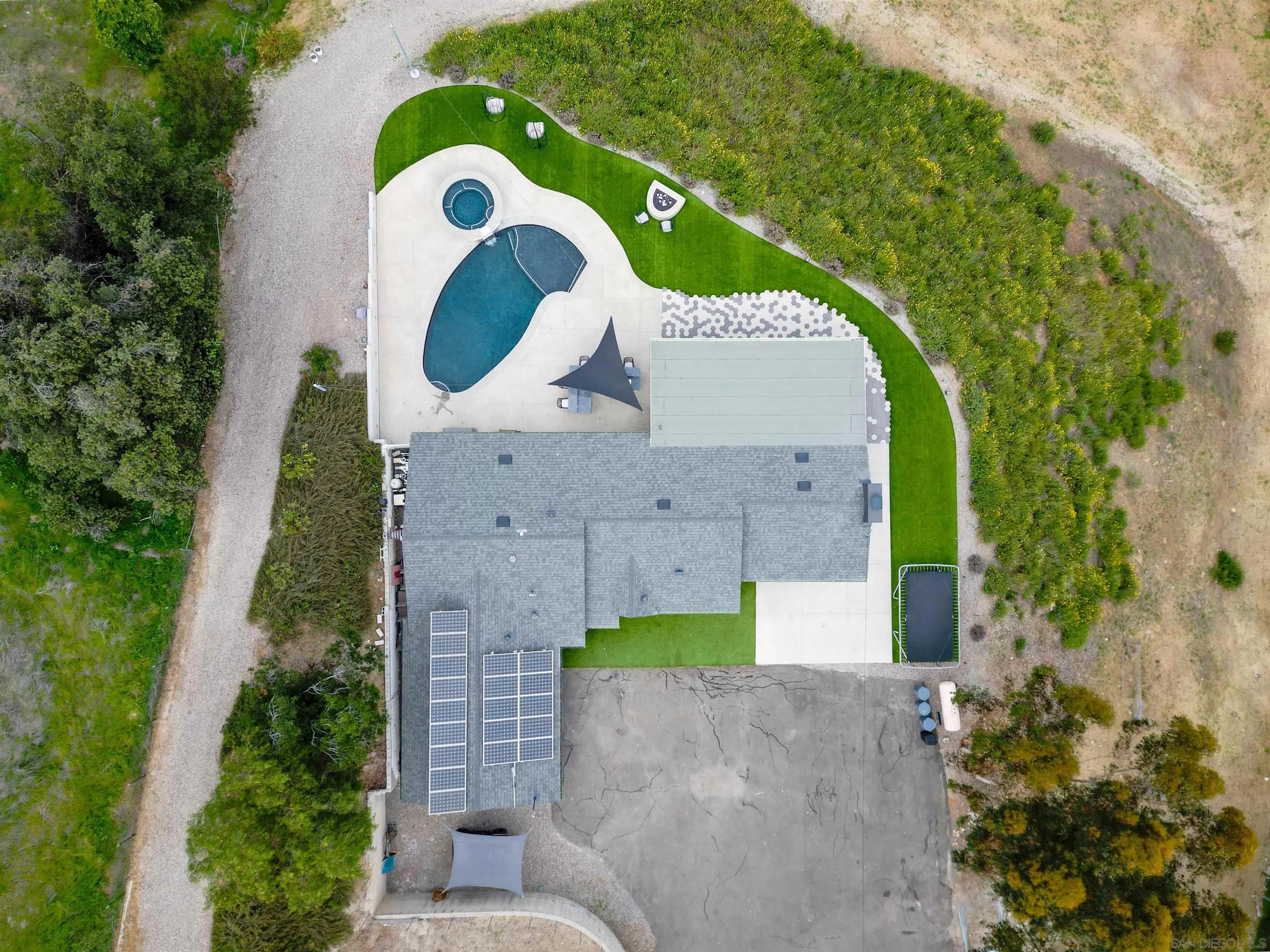 11911 Rocoso Road Lakeside, CA 92040 - Photo 26 of 32 an aerial view of a house with a garden and trees