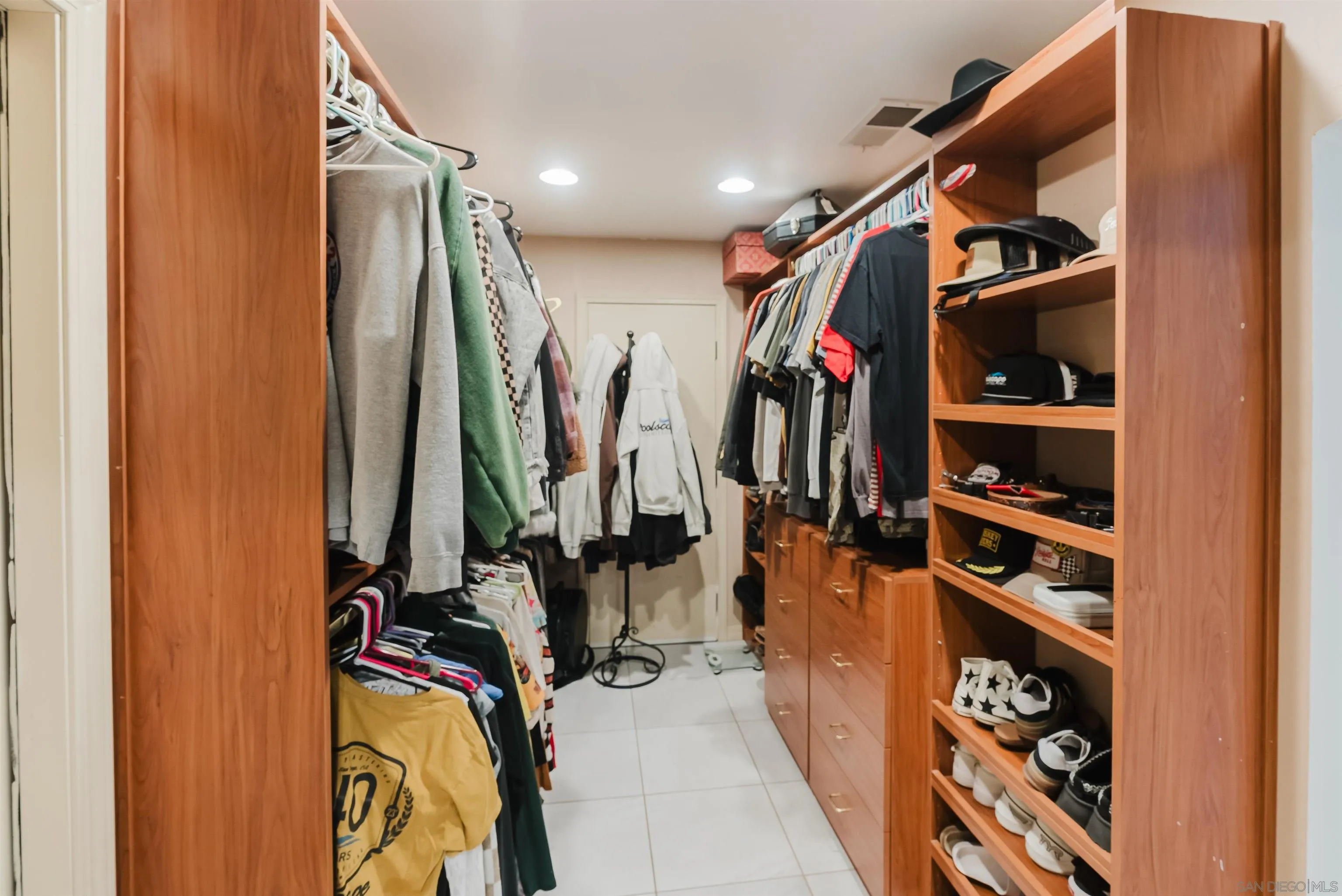 11911 Rocoso Road Lakeside, CA 92040 - Photo 30 of 32 a view of walk in closet with clothes and shoes
