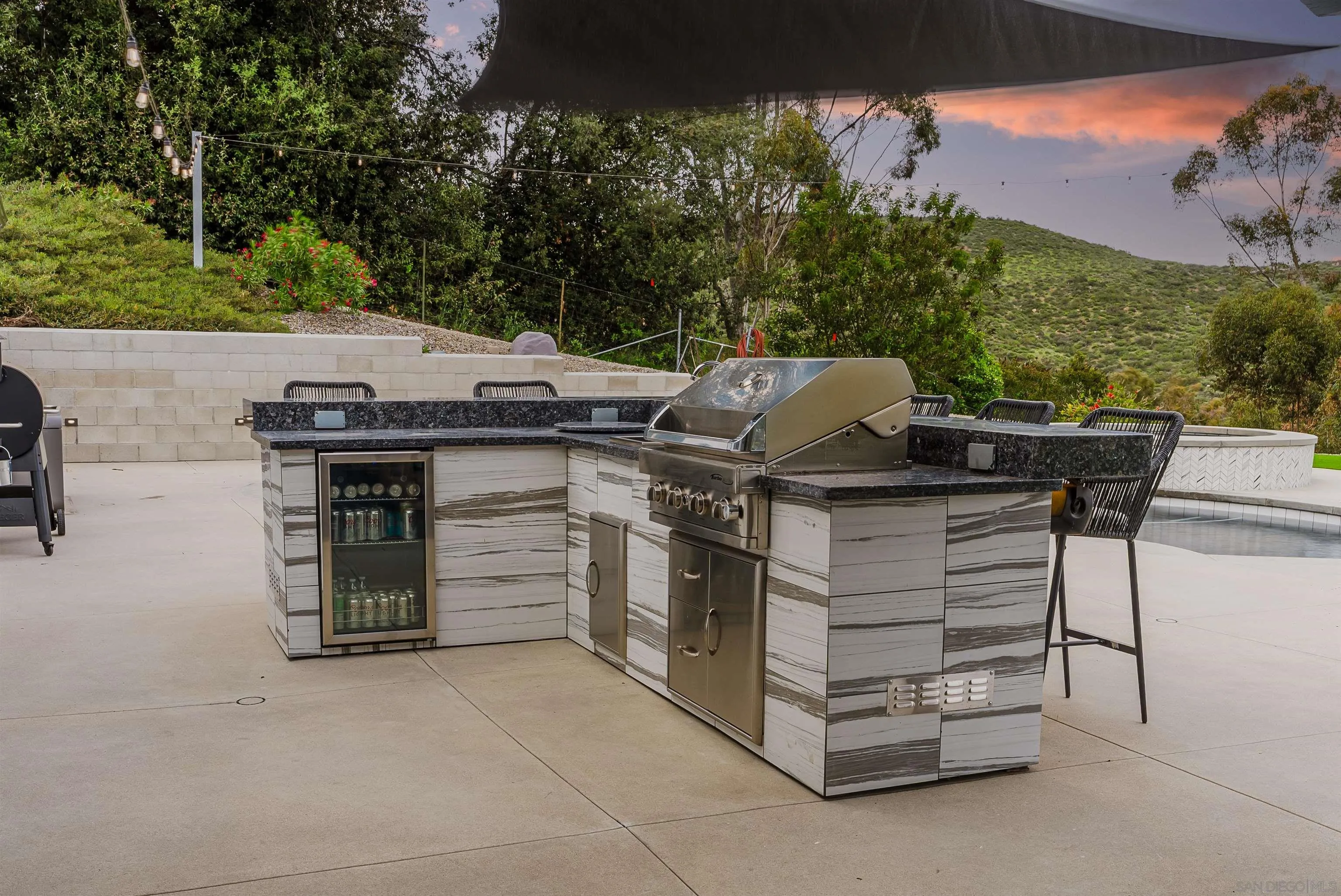 11911 Rocoso Road Lakeside, CA 92040 - Photo 9 of 32 a view of a terrace with a table and chairs