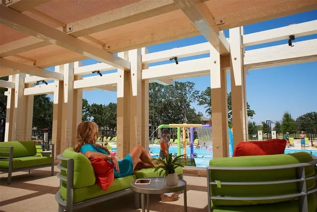 a room with green walls and furniture