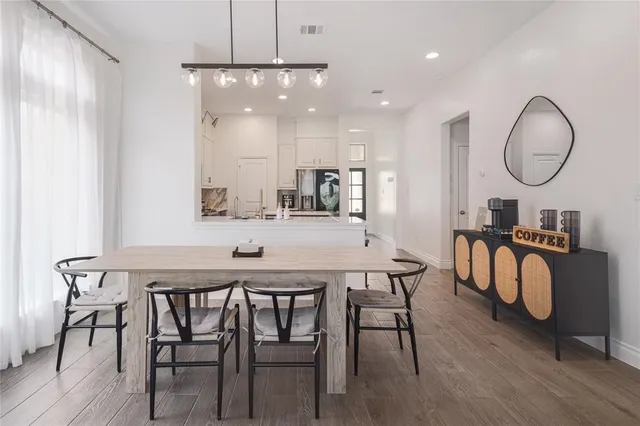 a kitchen with a table and chairs in it
