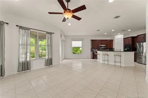 a view of a kitchen with appliances and a dining table