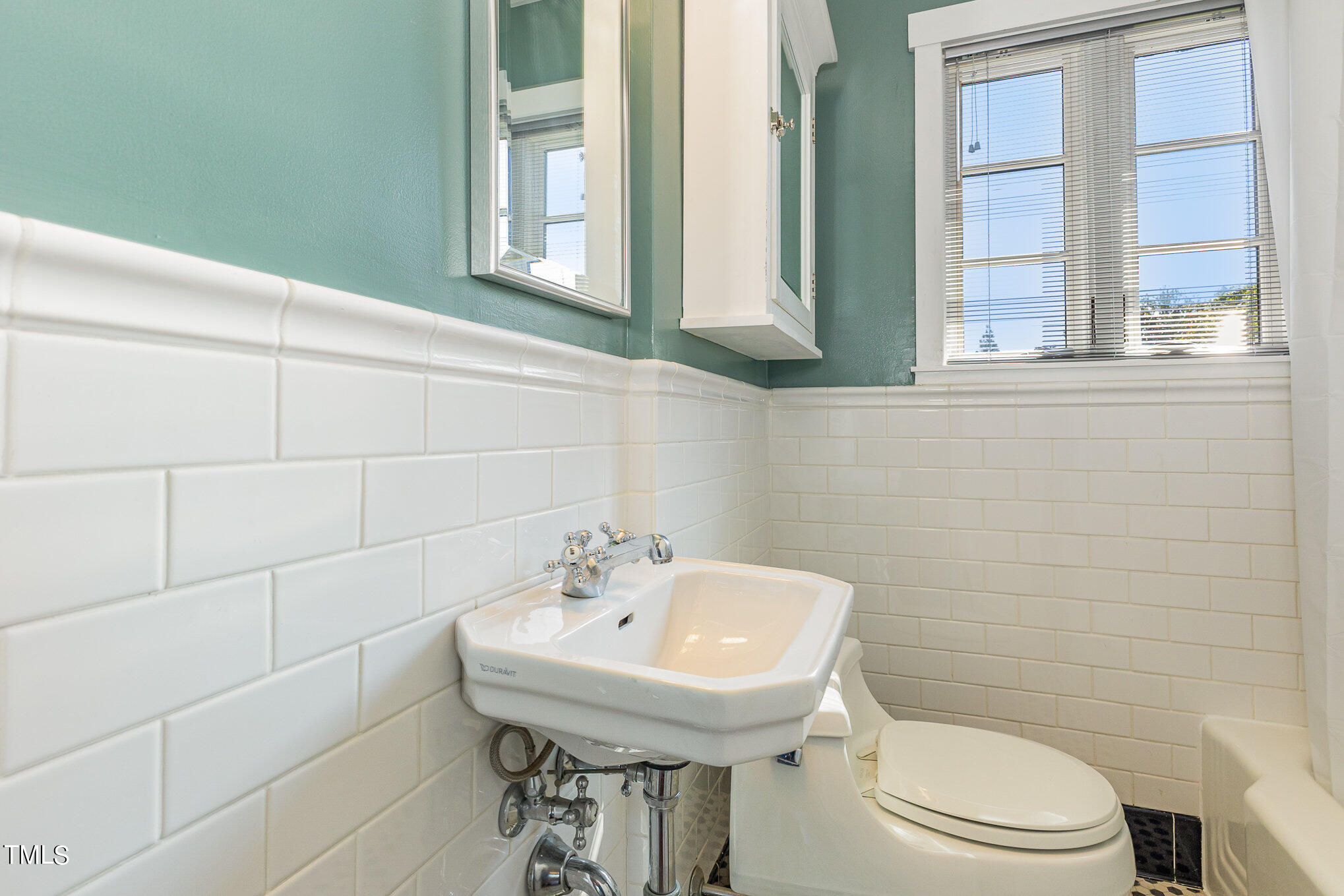 1629 St Marys Street Raleigh, NC 27608 - Photo 28 of 39 This hall Bath has the iconic black & white tile floor with a tub & shower.