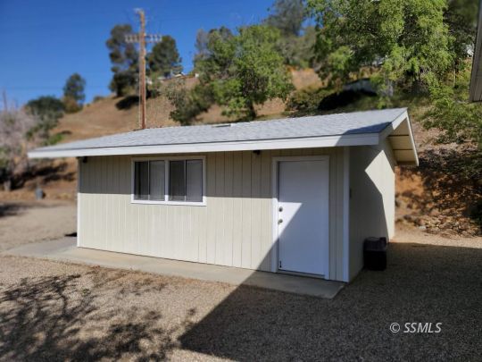 71 Adams Road Wofford Heights, CA 93285 - Photo 24 of 27 a view of a house with a backyard