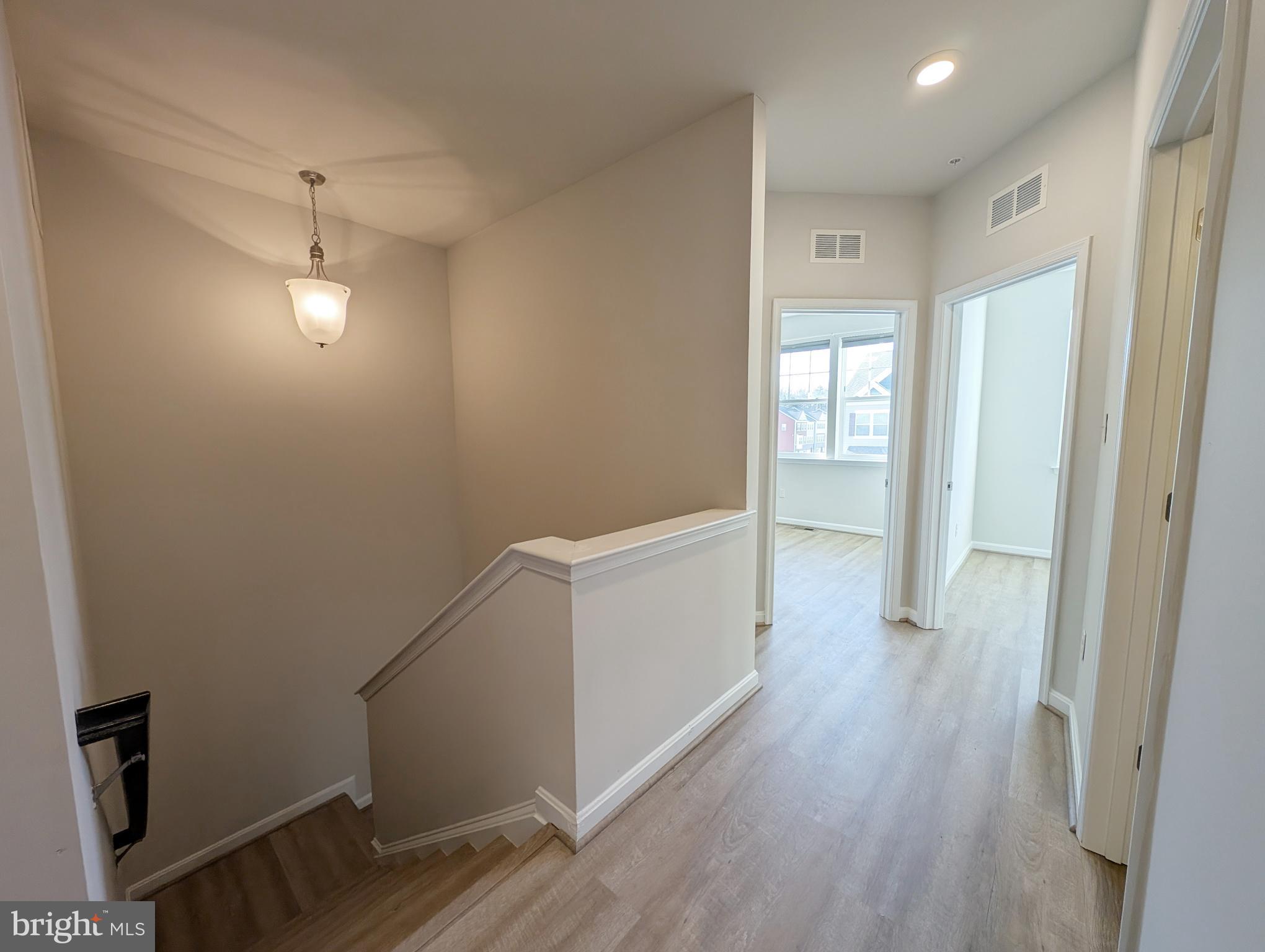3106 Laurel Hill Road Hanover, MD 21076 - Photo 13 of 27 a view of a room with wooden floor and windows
