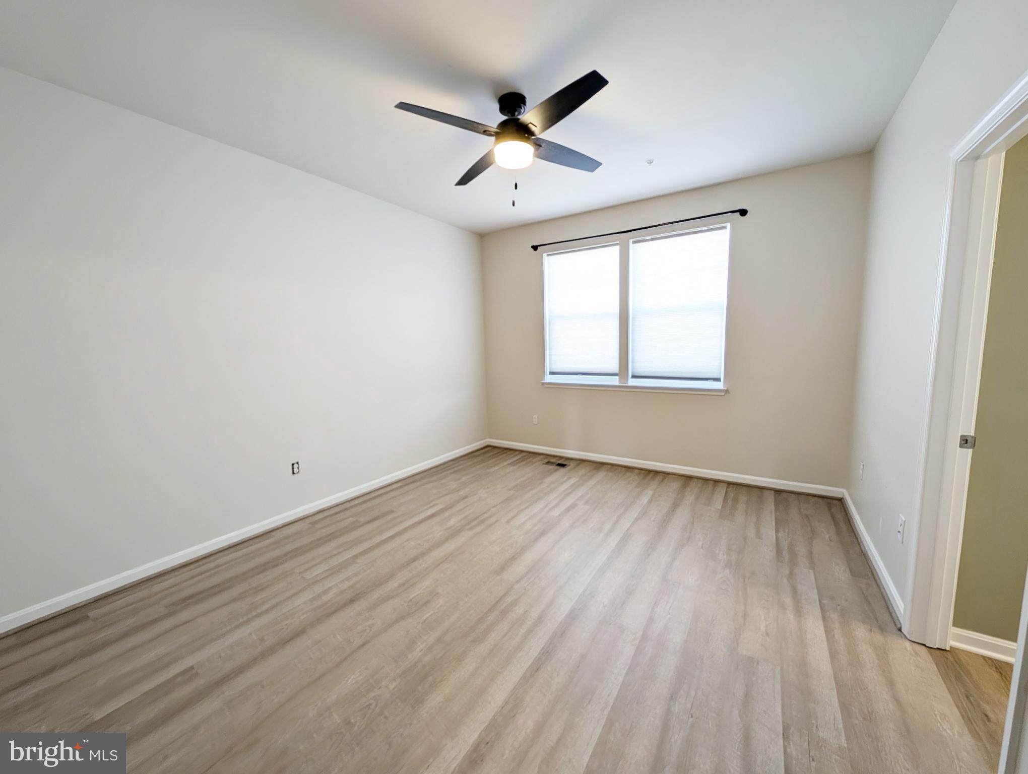 3106 Laurel Hill Road Hanover, MD 21076 - Photo 18 of 27 wooden floor in an empty room with a window