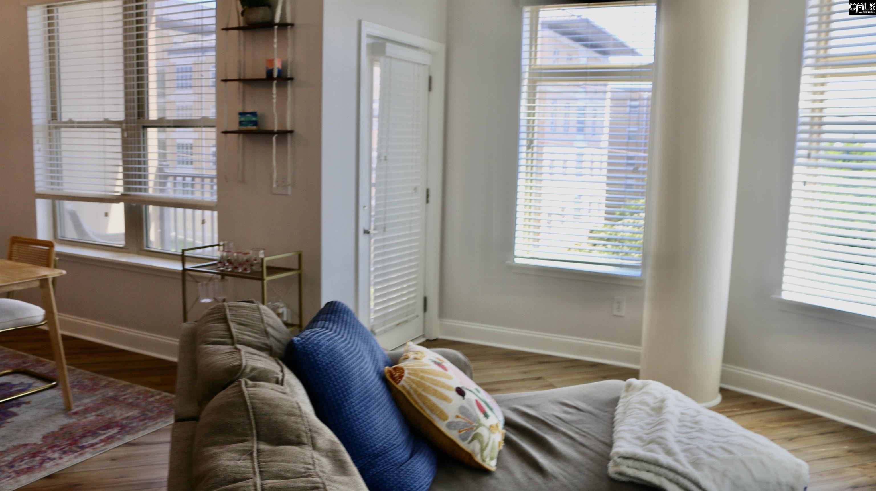 601 Main Street, Unit 323 Columbia, SC 29201 - Photo 27 of 68 a bedroom with a bed and a window