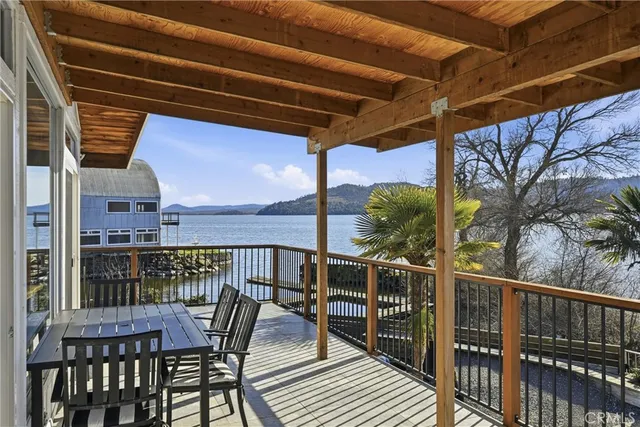 a view of a balcony with wooden floor and stairs