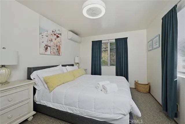 a bedroom with a bed and blue walls