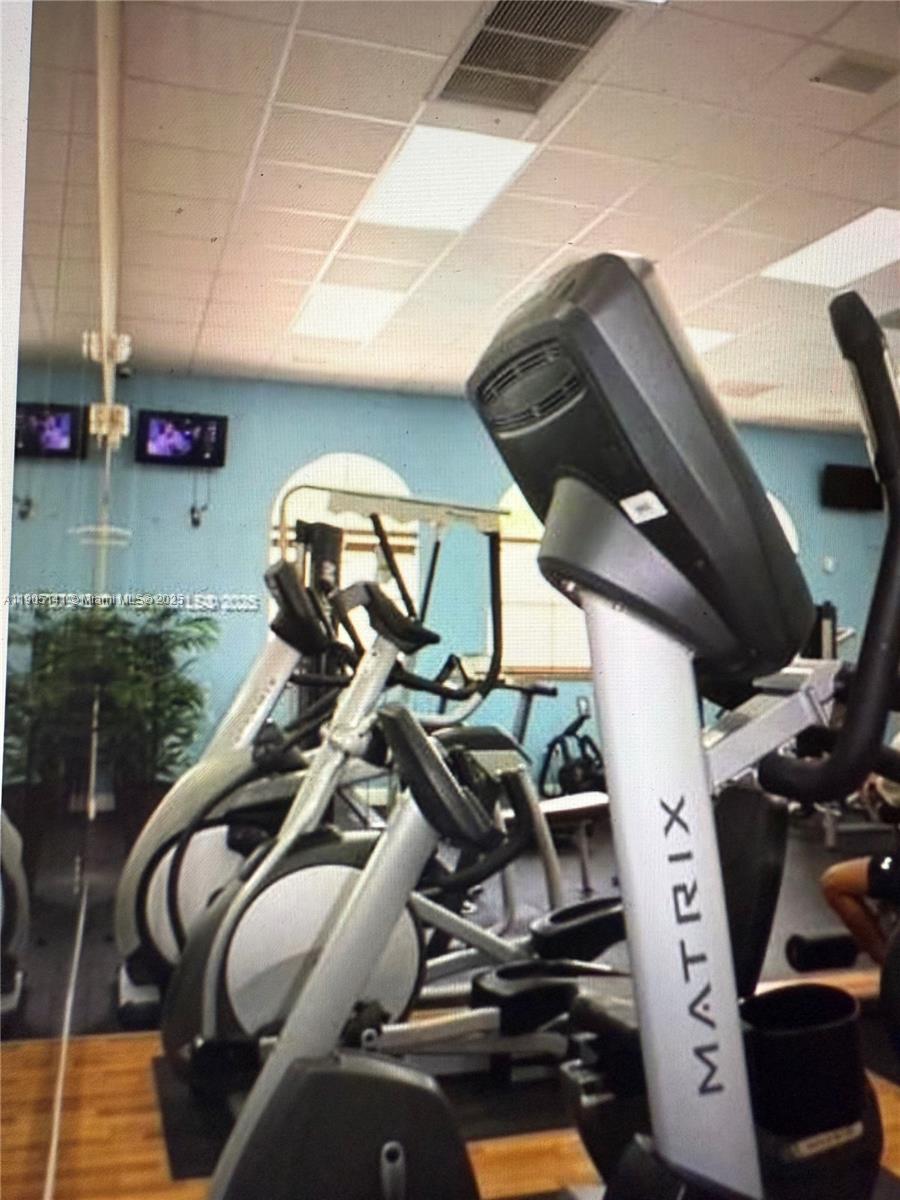 4932 Southwest 140th Terrace, Unit 1 Miramar, FL 33027 - Photo 25 of 27 a view of a room with gym equipment