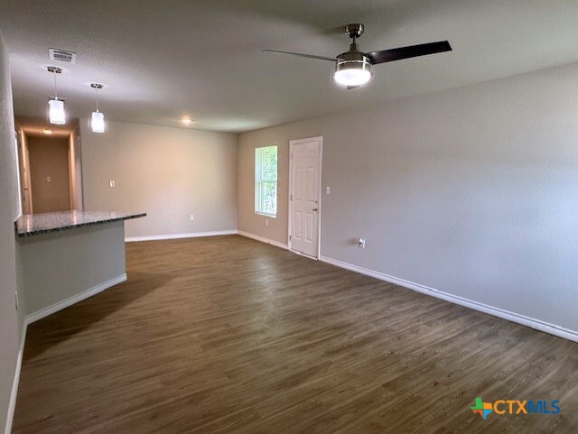 2410 Westcliff Road, Unit A & B Killeen, TX 76543 - Photo 2 of 21 an empty room with wooden floor and windows